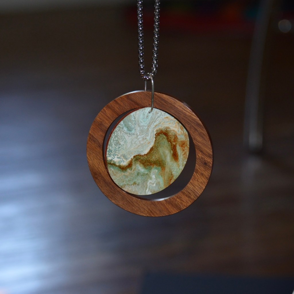 Original wearable art pendant.  Wood ring encased mini poured painting with large custom jump ring.