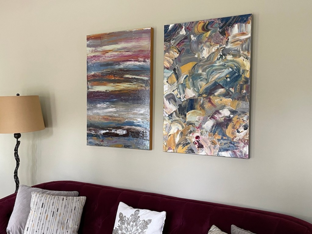 2 finished abstract paintings from large scale commission hung over sofa.